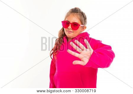 Fashionable Girl In Pink Sweatshirt, Pink Sunglasses Refuces Something, Picture Isolated On White Ba
