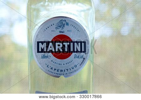 Kharkov, Ukraine - September 23, 2019: Bottle Of Vermouth Martini Rossi Close Up Logo On A Green Tre