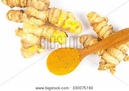 Turmeric Powder And Fresh Turmeric (curcuma) In Wood Spoon On White Background. Herbal