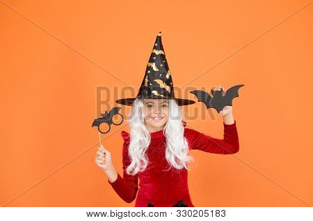 Curse Spell. Little Girl Cast Magic Spell Orange Background. Wicked Witch Spell. Magic And Witchcraf