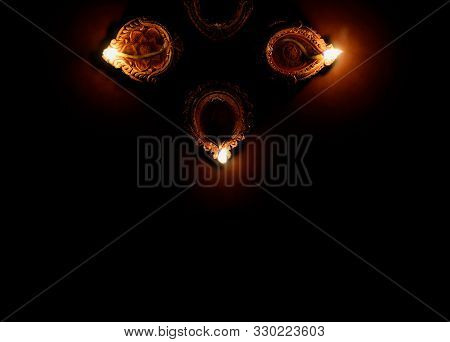 Earthen Oil Lamp Lit On The Occasion Of Deepavali, A Hindu Festival Of Light With Selective Focus On
