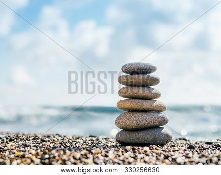 Stones Balance On Beach With Copy Space For Text Or Design. Stones Pyramid As Zen, Harmony, Balance 