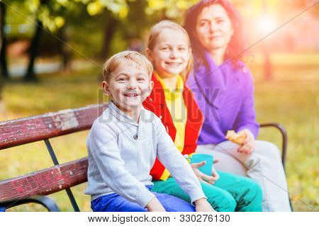Happy Mother With Two Laughing Smiling Emotional Two Blond Children, Brother And Sister At Autmn Par