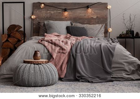 Yerba Matte On Wooden Plate On Grey Woolen Pouf In Stylish Bedroom Interior