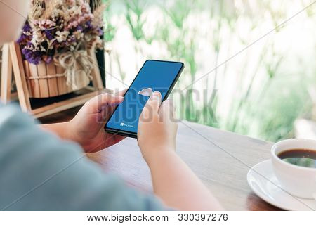 Chiang Mai, Thailand - Oct.18,2019: Woman Holding Xiaomi Mi Mix 3 With Onedrive On Screen. Microsoft