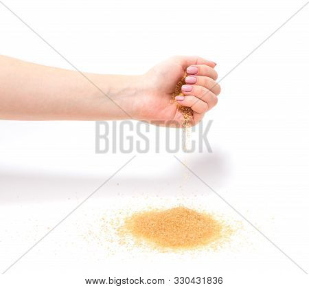 A Stream Of Sugar Pours From His Hand. Isolated Background.