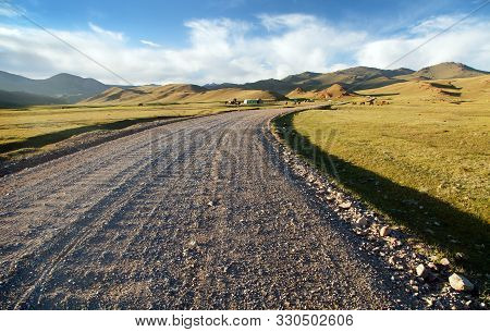 Unpaved Road And Yurts Near Son-kul Lake And Tian Shan Mountains In Kyrgyzstan