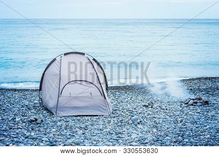Cooking Of The Barbecue And Tourist Tent On The Beach At Evening Time.