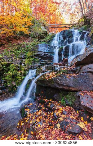 Waterfall Shypot Of Carpathian Mountains In Autumn. Lake, Water. Fallen Foliage And Moss On A Massiv