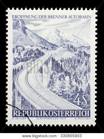 ZAGREB, CROATIA - JULY 03, 2014: A stamp issued in the Austria shows the Brenner Highway - Europabrucke part of the Brenner Motorway, circa 1971.