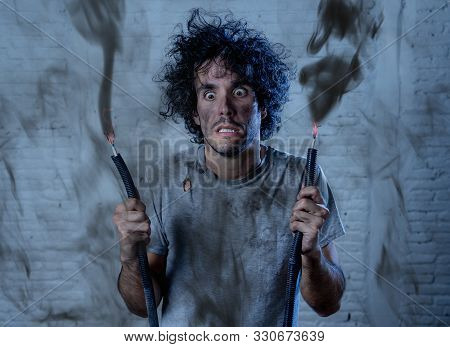 Funny Image Of Man Holding Electrical Cable After Getting Electric Shock