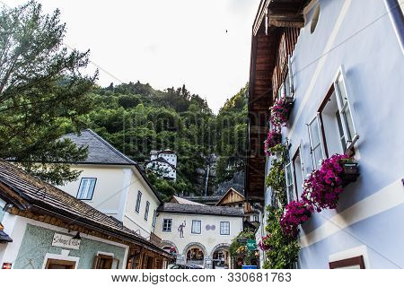 Hallstadt, Austria - July, 2019: Beautiful Houses Of Hallstadt, Austria. Tourist Destinations.