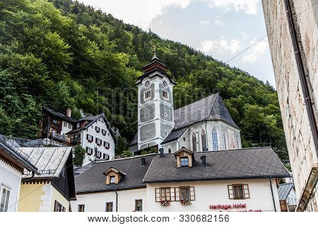 Hallstadt, Austria - July, 2019: Beautiful Houses Of Hallstadt, Austria. Tourist Destinations.