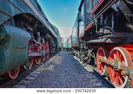 Between Wagons Of Old Trains, Between Two Old Trains, Red Metal Train Wheels