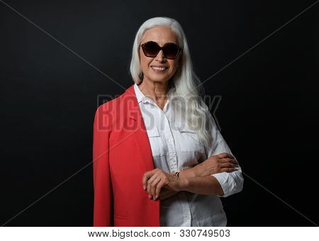 Portrait Of Beautiful Mature Woman On Black Background