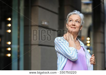Happy Mature Woman On City Street, Space For Text. Smart Aging