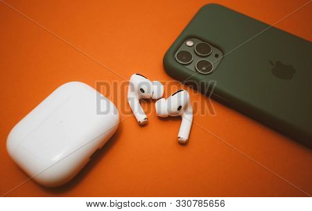 Paris, France - Oct 30, 2019: Charging Case And The New Iphone 11 Pro Next To New Apple Computers Ai