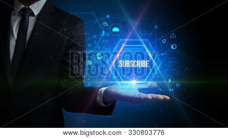Man hand holding SUBSCRIBE inscription, social media concept