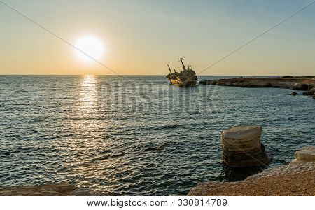 Beautiful Seascape And Shipwreck. Abandoned Ship Edro Iii At Sunset Near The Paphos, Cyprus.