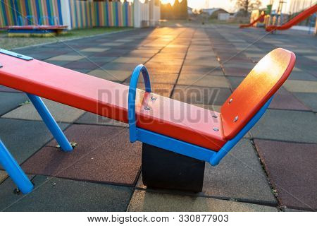 Rubber Coating And Flip Flap Swing At The Playground At Preschool.