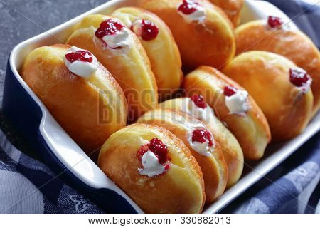 Berliner Pfannkuchen, German Donuts With Raspberry Jam And Cream Fillings In A Baking Dish On A Conc