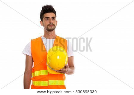 Studio Shot Of Young Persian Man Construction Worker Holding Saf