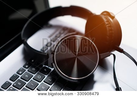 Headset Or Headphone On Laptop Keyboard For Helpline Customer On Communication And Hotline Support C