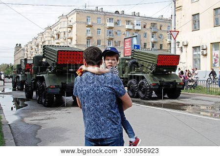 Volgograd, Russia - May 09, 2019: Dad And Son Watching A Military Parade On Victory Day In Volgograd