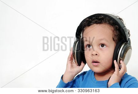 Boy With Headphones Enjoying Music   On White Background Stock Photo