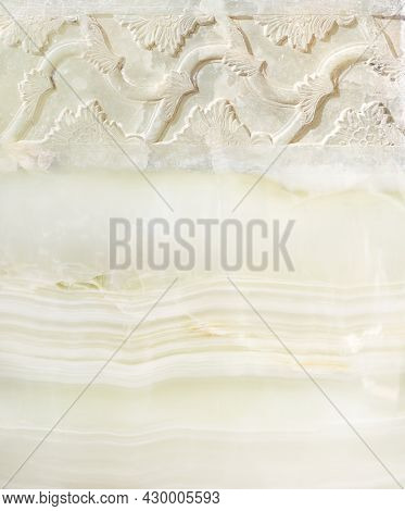 Retro background with ancient carved ornament on marble. Vertical banner with floral stone bas-relief. Mock up template. Copy space for text