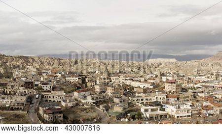 Aerial View Of Old Cappadocia Park In Turkey. Action. Stone Houses And Buildings Surrounded By Rocks