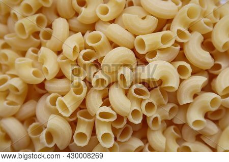 Dry Raw Yellow Pasta. Italian Pasta Close-up