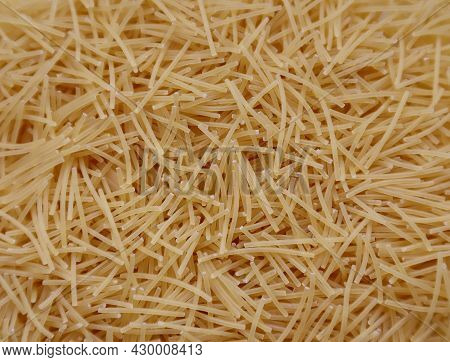 Background Closeup Pasta Texture . Small Vermicelli. Raw Small Noodles.