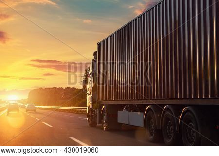 Scenic Front View Big Long Heavy Semi-treailer Truck With Sea Shipping Container Driving Highway Dra