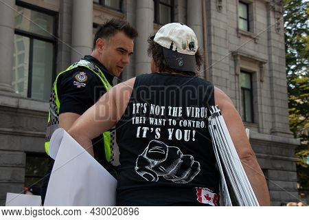 Vancouver, Canada - August 14, 2021:a Man Is Wearing T-shirt  With A Sign It's Not The Virus They Wa