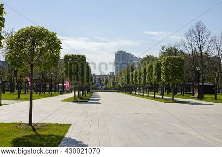 Moscow, Russia - August 15, 2021: Dream Island Amusement Park. Walking Alley With Trimmed Trees, Pho