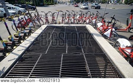 Bucharest, Romania - August 12, 2021: Splash Electric Scooters And Citylink Bikes Are Parked On A Si