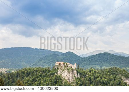 Selective Blur On The Bled Castle, Also Called Blejski Hrad, During A Cloudy Rainy Afternoon Surroun