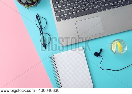 Online Education Concept, Online Training. Laptop,glasses, Notebook, Microphone And A Glass Of Water