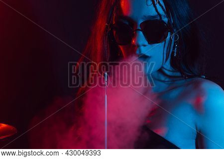Hookah Atmosphere. Large Portrait Of A Girl Who Enjoys Smoking A Hookah, Sheesha.