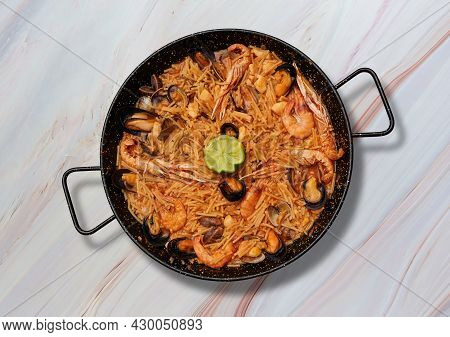 Traditional Fideua From Spain On Marble Background. Paella