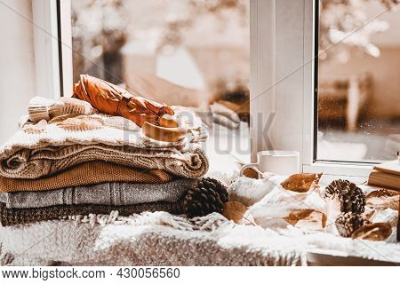 Corns, Autumn Leaves, Pine Cones And Coffee Cup On Windowsill. Creative Autumnal Background Near The