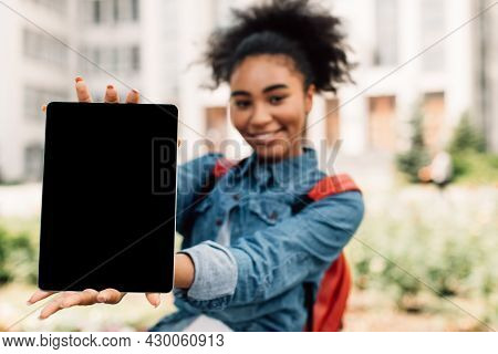 African American Student Girl Showing Digital Tablet Blank Screen Outdoors