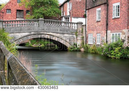 Winchester, United Kingdom, 10th August 2021:- A Long Exposure Of The Bridge Over The River Itchen N