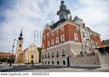 Hodonin, South Moravia, Czech Republic, 03 July 2021: Baroque Church Of St. Lawrence And Town Hall W