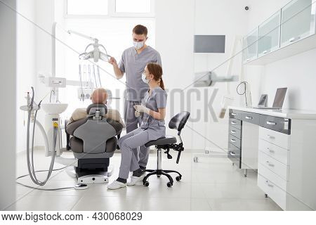 Hospital Two Doctors In Medical Uniform Looking Into Sick Pacient Mouth Analyzing Teeth Health Prepa