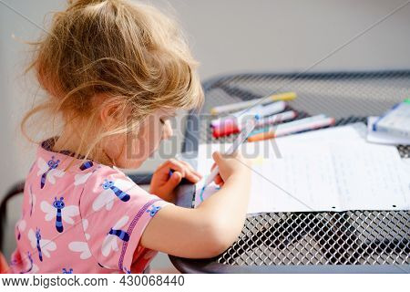 Happy Preschool Girl Learning Painting With Colorful Pencils And Felt Pens. Little Toddler Drawing A