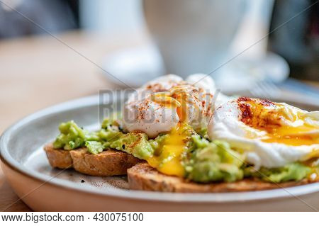 Healthy Breakfast With Wholemeal Bread Toast And Poached Egg With Mashed Avocado