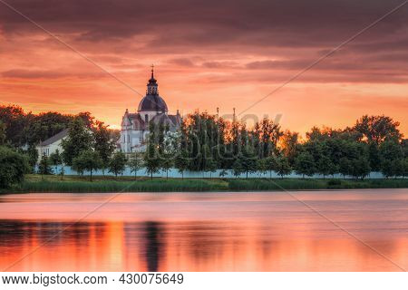 Nesvizh, Minsk Region, Belarus. Corpus Christi Church And Castle Pond Lake At Summer Sunset Evening 