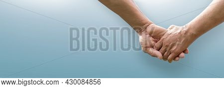 Senior Couple Holding Hands Together On Isolated Blue Background. Lover, Valentine's Day Concept. Ba